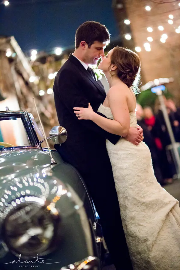 Bride and groom by vintage car at evening Washington wedding. Lovely Events.